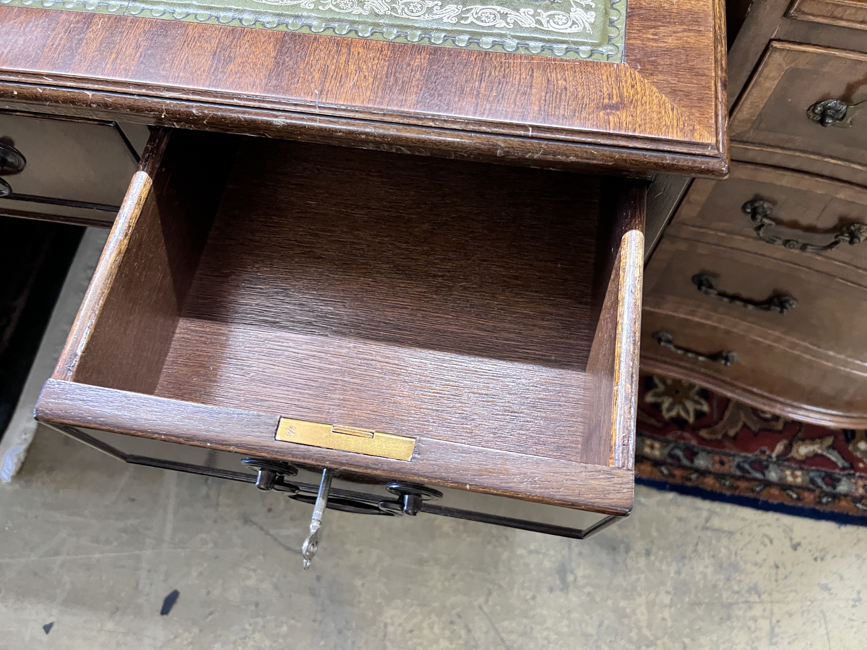 A reproduction mahogany pedestal desk, width 122cm